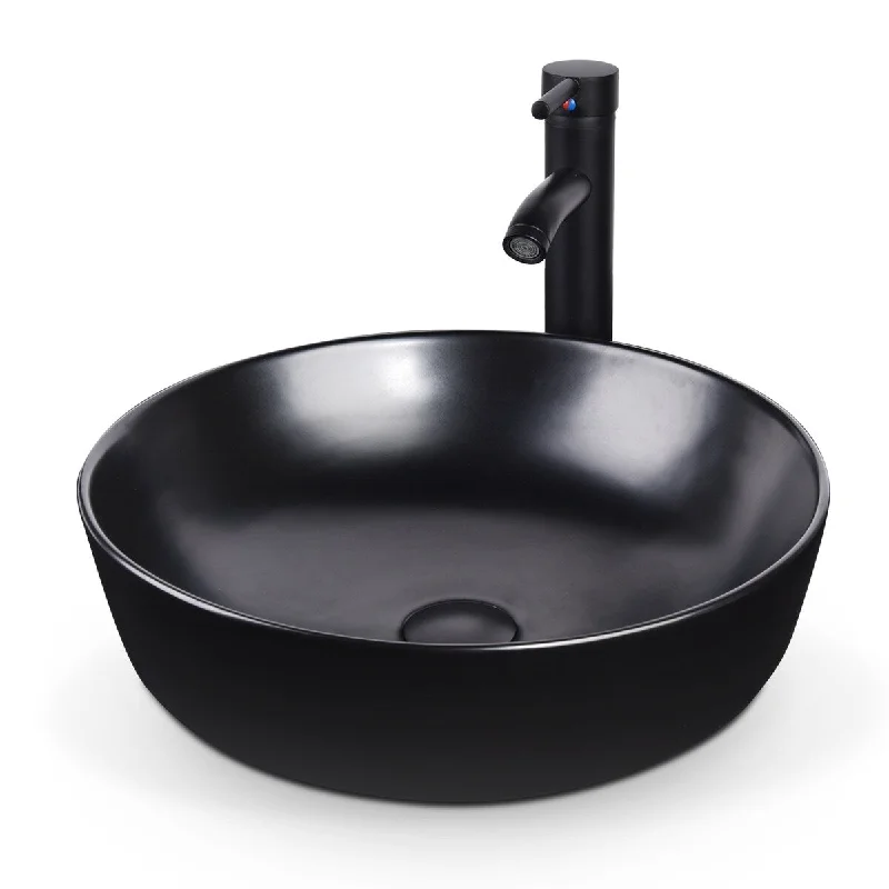 Black round ceramic bathroom sink bowl and chrome faucet